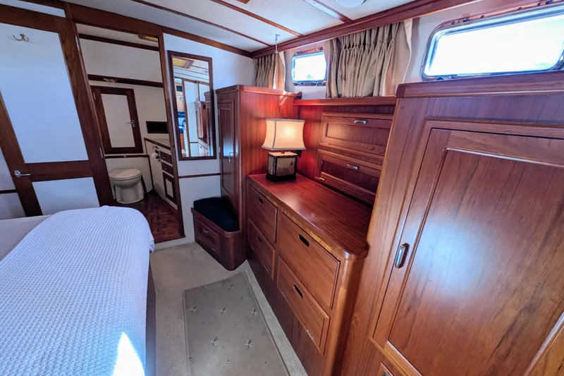 Slide: The Image of Luxurious 2001 Dettling 51 yacht interior with elegant wood cabinetry and cozy lighting. - 43
