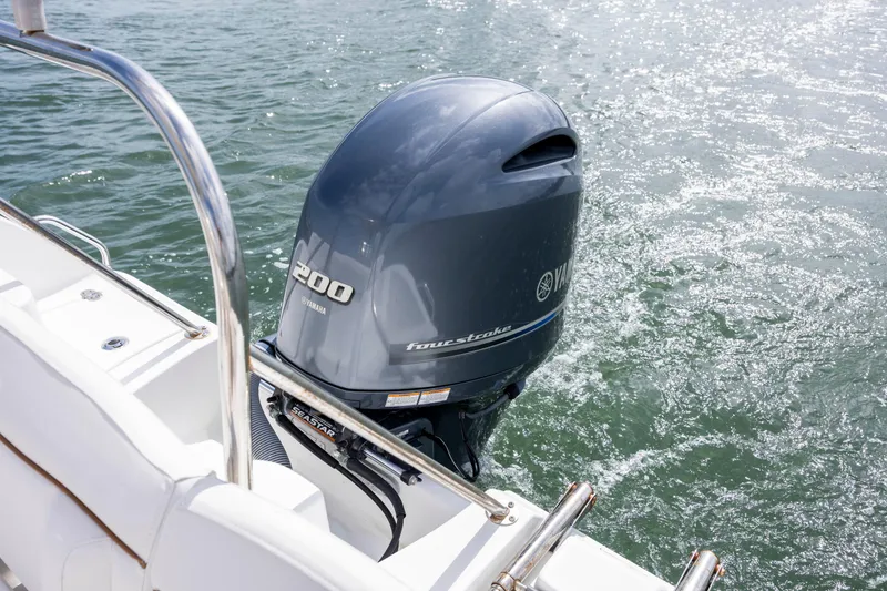 Slide: The Image of 2020 Sea Hunt Ultra 225 boat with Yamaha 200 outboard motor on water. - 19