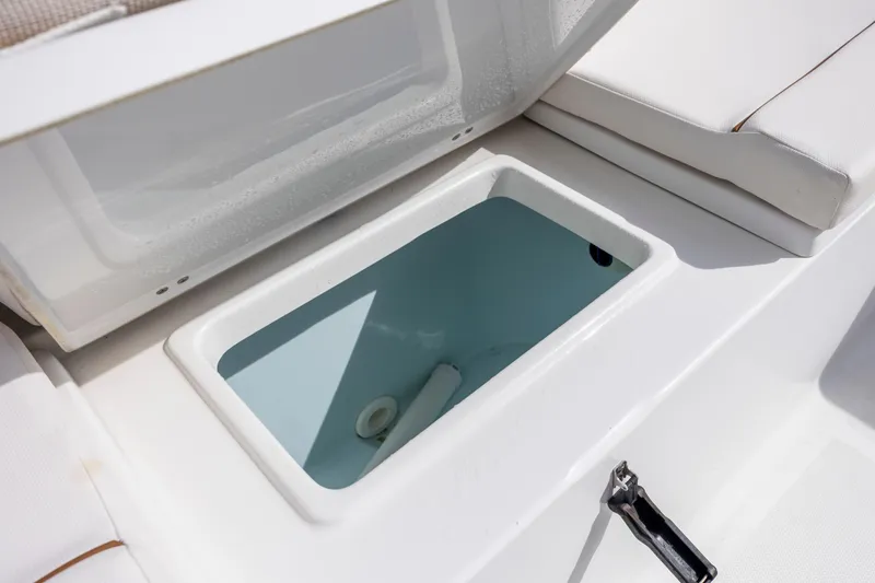 Slide: The Image of Open storage compartment on 2020 Sea Hunt Ultra 225 boat. - 24