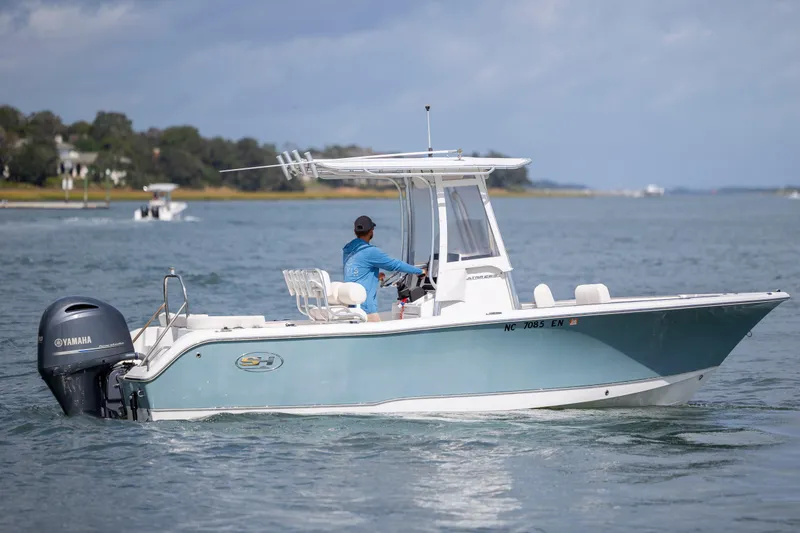 Slide: The Image of 2020 Sea Hunt Ultra 225 boat cruising on a calm waterway with Yamaha engine. - 3