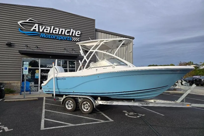 Slide: The Image of 2024 Sea Fox 228 Traveler boat on trailer outside Avalanche Motorsports. - 1