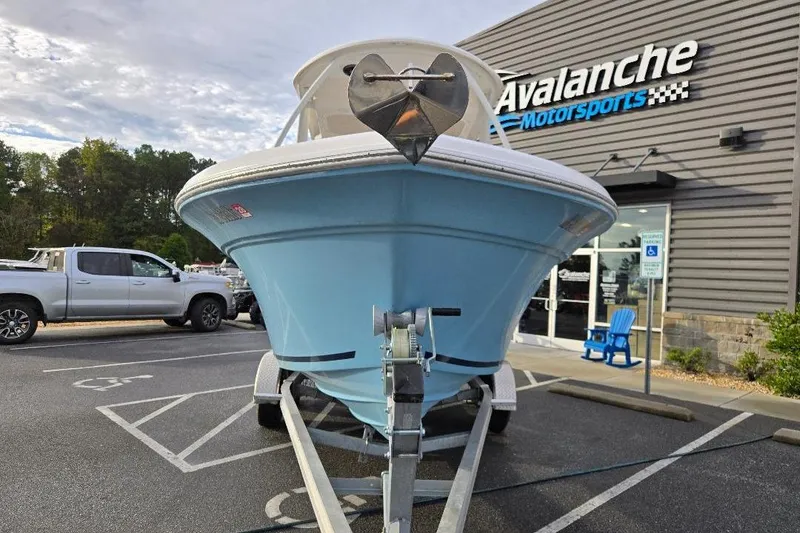 Slide: The Image of 2024 Sea Fox 228 Traveler boat on trailer at Avalanche Motorsports dealership. - 2