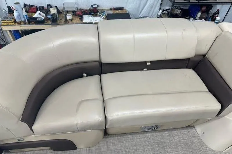 Slide: The Image of 2019 Sun Tracker Party Barge 22 RF DLX beige and brown seating area. - 10