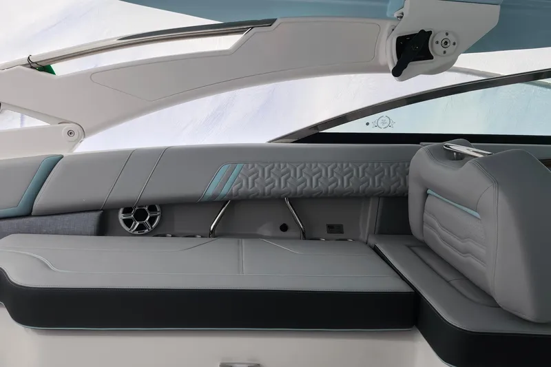 Slide: The Image of 2026 Regal LX9 boat with sleek design and modern features, docked at a marina. - 13