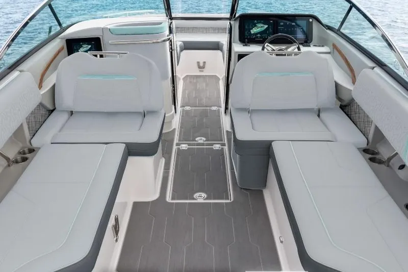 Slide: The Image of 2026 Regal LX9 boat cruising on clear turquoise waters with passengers onboard. - 2