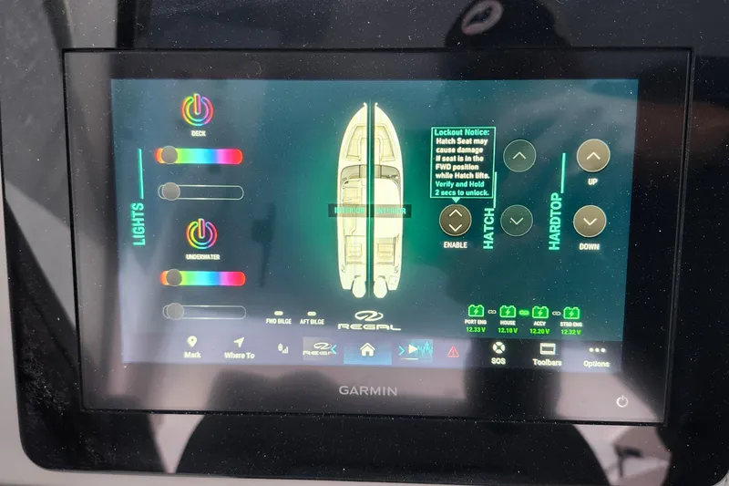 Slide: The Image of 2026 Regal LX9 boat interior with open storage compartment and control panel. - 20