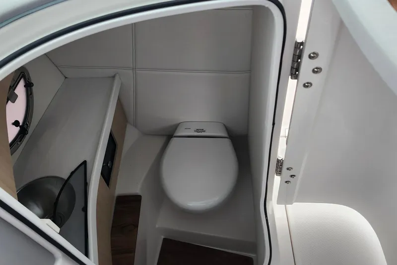 Slide: The Image of 2026 Regal LX9 boat interior with modern dashboard and sleek steering wheel design. - 21