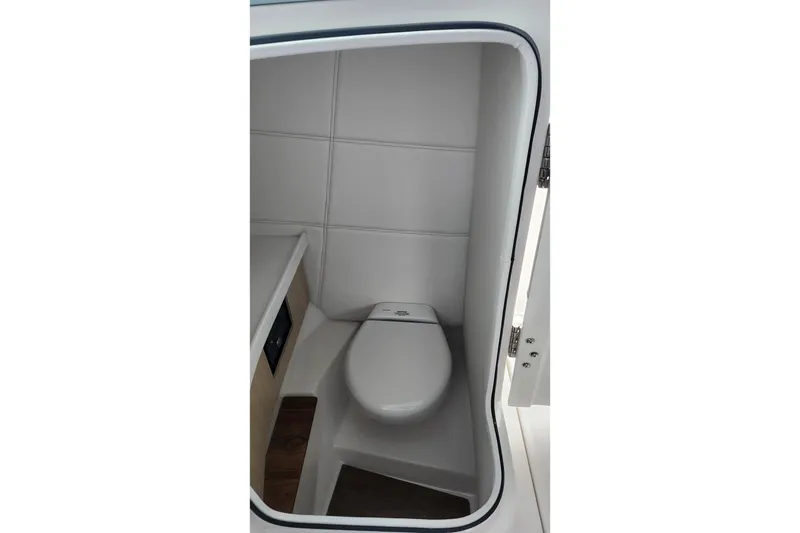 Slide: The Image of Interior of 2026 Regal LX9 boat with modern dashboard and luxurious seating. - 22