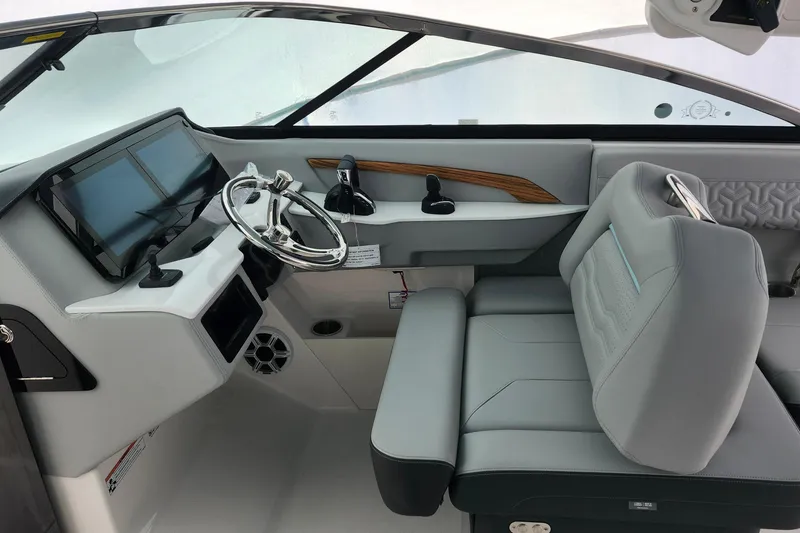 Slide: The Image of 2026 Regal LX9 dashboard with dual Garmin displays and joystick control. - 24