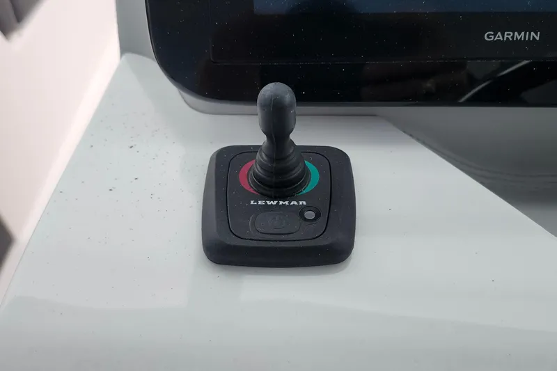 Slide: The Image of 2026 Regal LX9 boat interior with open hatch and modern dashboard. - 30