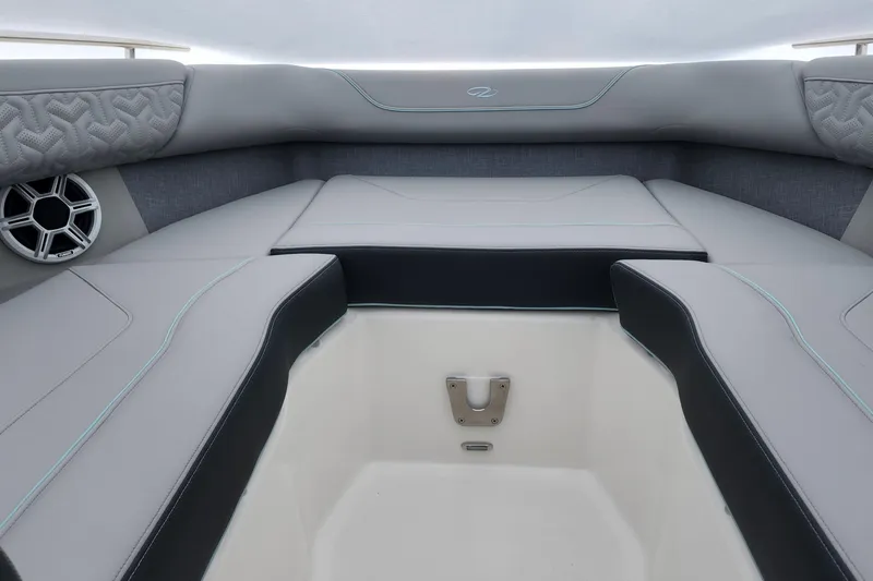 Slide: The Image of Luxurious interior of 2026 Regal LX9 boat with elegant wooden table and cushioned seating. - 35