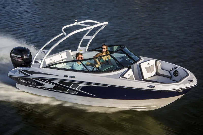 The Image of 2019 Monterey M-205 boat on blocks, displayed outdoors under clear blue sky. - 0