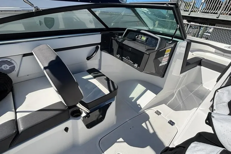 Slide: The Image of 2019 Monterey M-205 boat interior with seating and dashboard controls. - 10