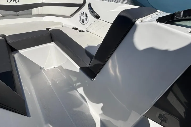 Slide: The Image of 2019 Monterey M-205 boat interior with black and white seating and storage compartment. - 7