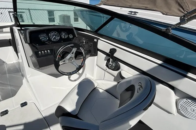 Slide: The Image of 2019 Monterey M-205 boat interior with steering wheel and dashboard controls. - 8