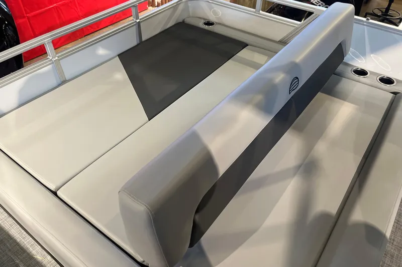 Slide: The Image of 2026 Sun Tracker Party Barge 22 RF XP3 seating area with cup holders and sleek design. - 12