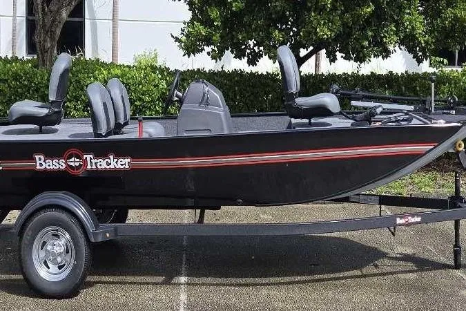 Slide: The Image of 2026 Tracker Bass Tracker Classic XL boat on trailer, parked outdoors. - 63
