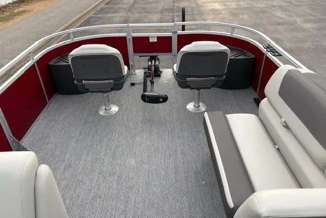 Slide: The Image of 2026 Sun Tracker Fishin' Barge 22 DLX interior with seating and fishing setup. - 87