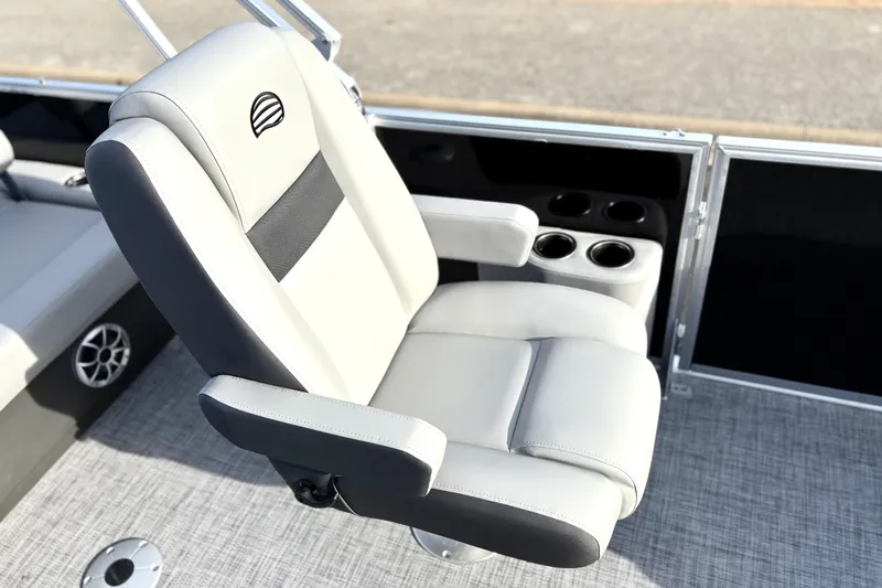Slide: The Image of 2026 Sun Tracker Party Barge 22 RF DLX captain's chair with cup holders and sleek design. - 17