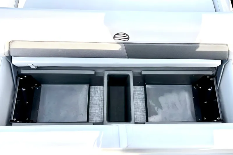 Slide: The Image of 2026 Sun Tracker Party Barge 22 RF DLX storage compartments, open and empty. - 21