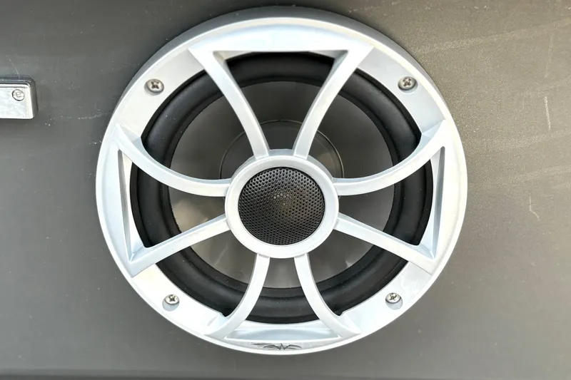 Slide: The Image of Close-up of a speaker on a 2026 Sun Tracker Party Barge 22 RF DLX. - 28