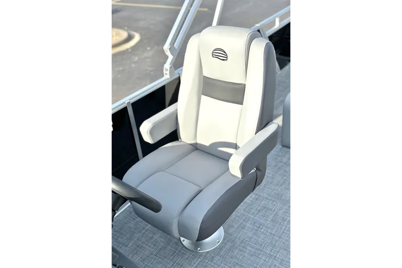 Slide: The Image of 2026 Sun Tracker Party Barge 22 RF DLX captain's chair, gray upholstery, sleek design. - 29