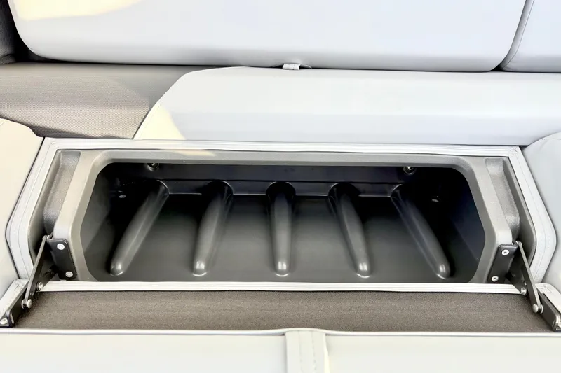 Slide: The Image of 2026 Sun Tracker Party Barge 22 RF DLX storage compartment, open and empty. - 35