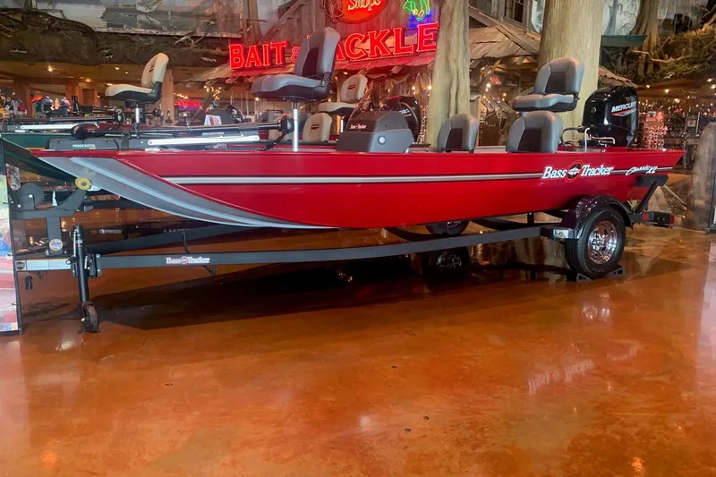 The Image of 2026 Tracker Bass Tracker Classic XL boat displayed indoors with vibrant red color. - 0
