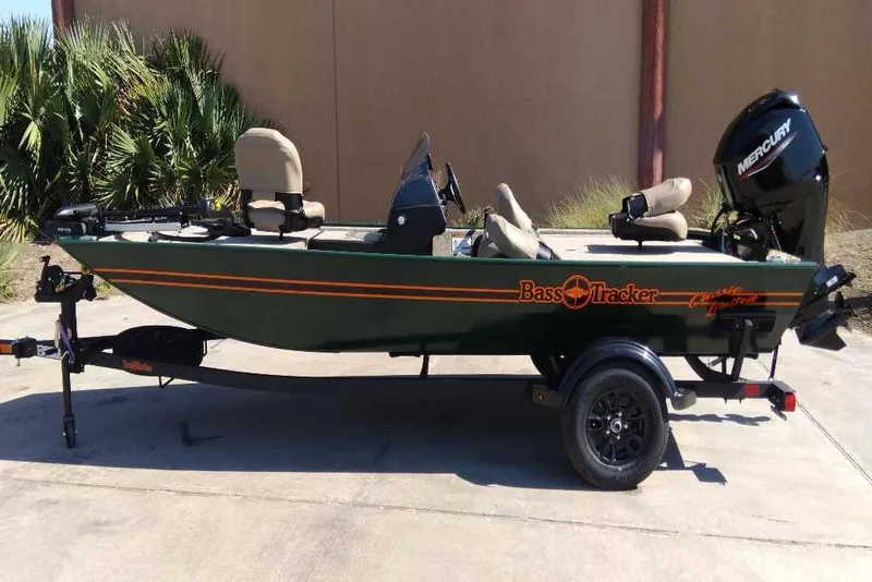 The Image of 2026 Tracker Bass Tracker Classic Limited boat on trailer, outdoor setting. - 0