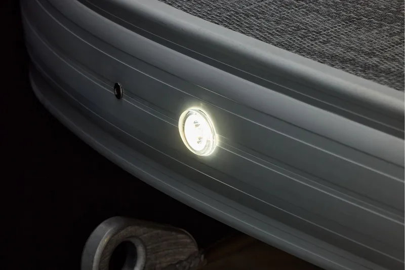 Slide: The Image of 2026 Sun Tracker SportFish 22 DLX logo on a sleek black surface. - 17