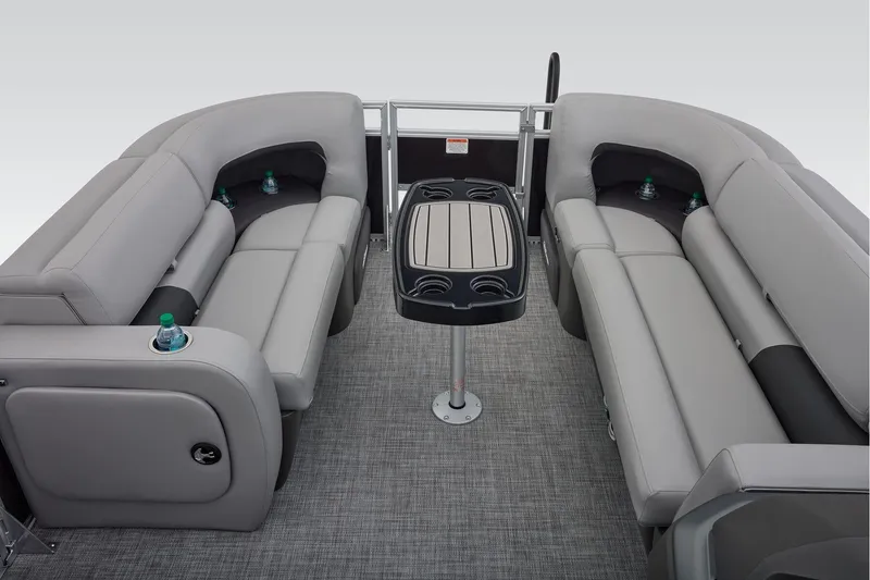 Slide: The Image of 2026 Sun Tracker SportFish 22 DLX pontoon boat interior with plush seating and modern helm. - 24