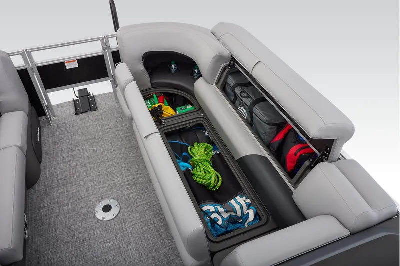 Slide: The Image of 2026 Sun Tracker SportFish 22 DLX boat interior with seating and storage area. - 29