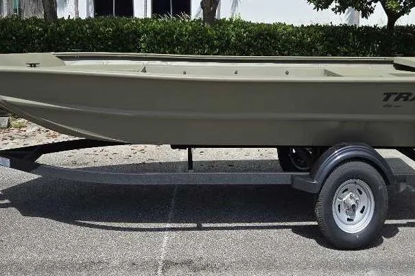The Image of 2026 Tracker Grizzly 1754 Utility boat on trailer, parked outdoors. - 0