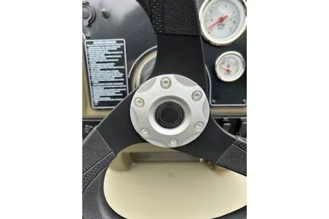 Slide: The Image of Steering wheel and dashboard of 2026 Tracker Grizzly 1860 CC boat. - 61