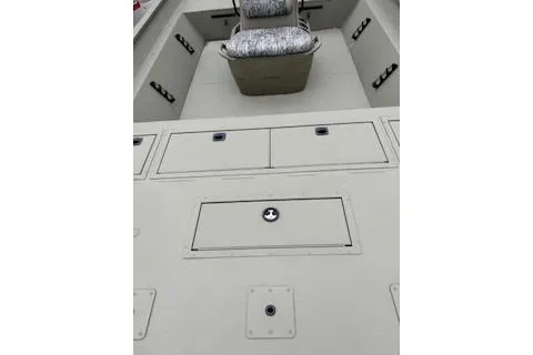 Slide: The Image of 2026 Tracker Grizzly 1860 CC boat interior with storage compartments and seating. - 62
