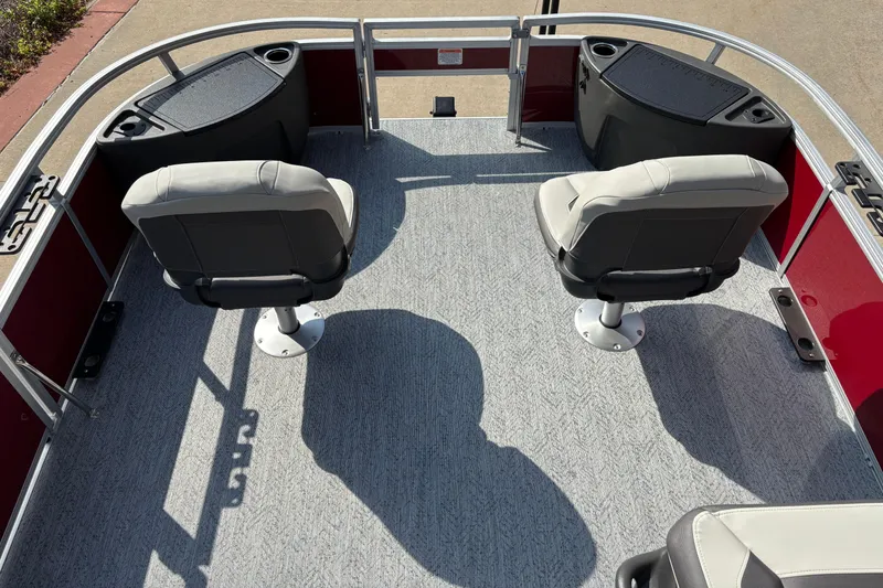 Slide: The Image of 2026 Sun Tracker Bass Buggy 18 DLX interior with two swivel seats and carpeted deck. - 3