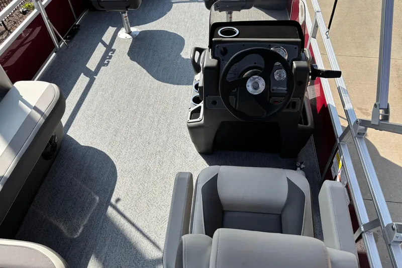 Slide: The Image of 2026 Sun Tracker Bass Buggy 18 DLX interior with steering console and seating. - 6
