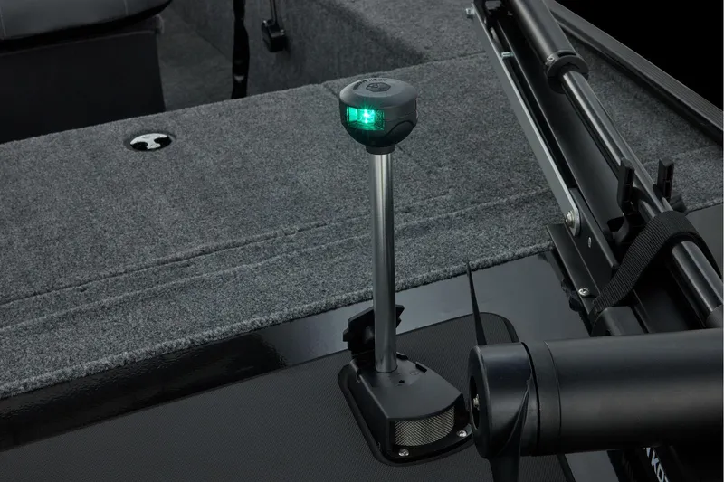 Slide: The Image of Storage compartment in 2026 Tracker Panfish 17 boat, featuring carpeted interior. - 14