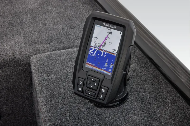 Slide: The Image of 2026 Tracker Panfish 17 boat interior with gray seating and carpeted flooring. - 17