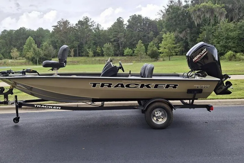 The Image of 2026 Tracker Pro Team 175 Crappie Edition boat on trailer, parked outdoors. - 0