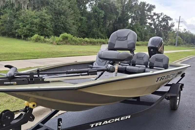Slide: The Image of 2026 Tracker Pro Team 175 Crappie Edition boat on trailer, parked roadside. - 3