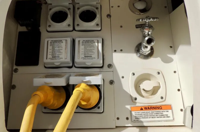 Slide: The Image of Dashboard of a 2016 Sea Ray 350 Sundancer boat with gauges and compass. - 14