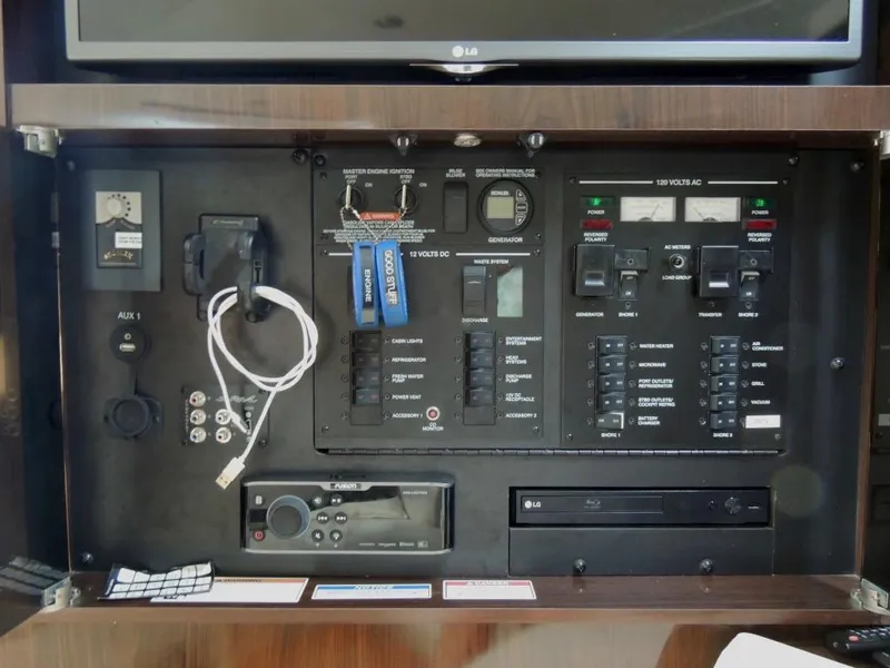 Slide: The Image of VHF radio and control panel on a 2016 Sea Ray 350 Sundancer boat. - 17