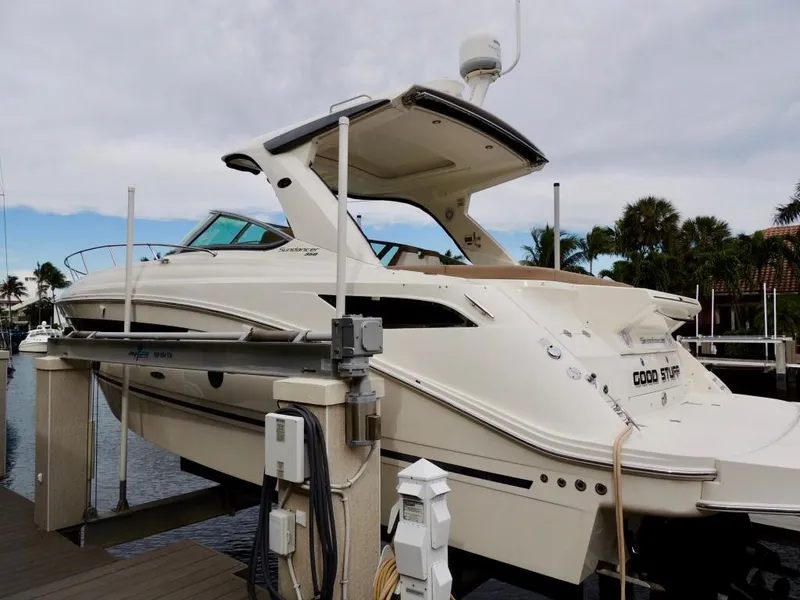 Slide: The Image of 2016 Sea Ray 350 Sundancer docked, side view with clear blue sky. - 2