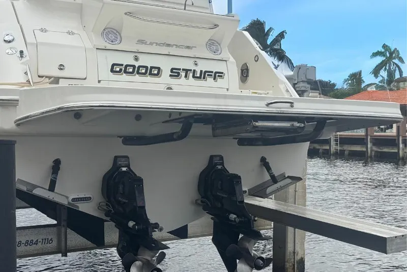 Slide: The Image of 2016 Sea Ray 350 Sundancer boat named "Good Stuff" docked by the water. - 3