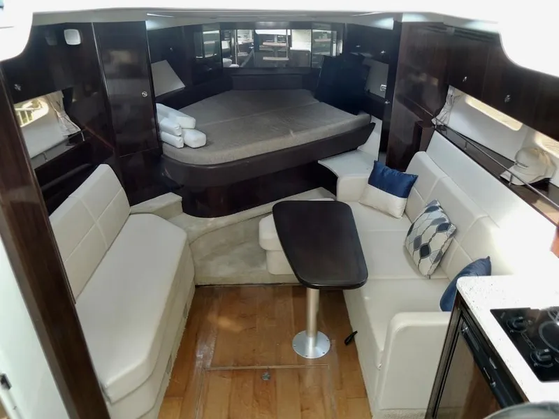 Slide: The Image of Modern kitchen area in 2016 Sea Ray 350 Sundancer yacht with microwave, sink, and mini-fridge. - 40