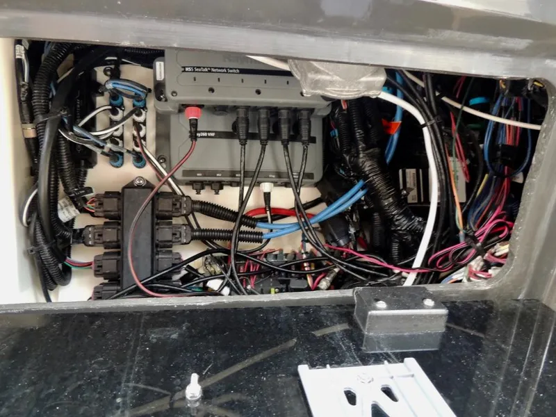 Slide: The Image of Electrical wiring and components inside a 2016 Sea Ray 350 Sundancer boat. - 63