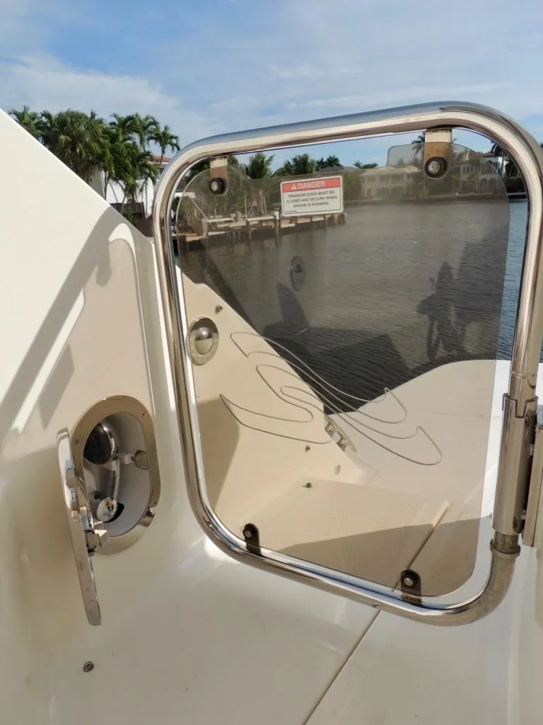 Slide: The Image of 2016 Sea Ray 350 Sundancer boat deck with water view. - 67