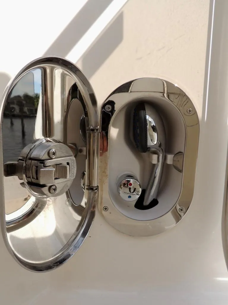 Slide: The Image of Close-up of the 2016 Sea Ray 350 Sundancer fuel cap and filler. - 68