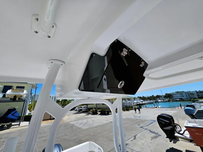 Slide: The Image of 2022 Century 2900 Center Console boat interior with overhead storage, dockside view. - 16